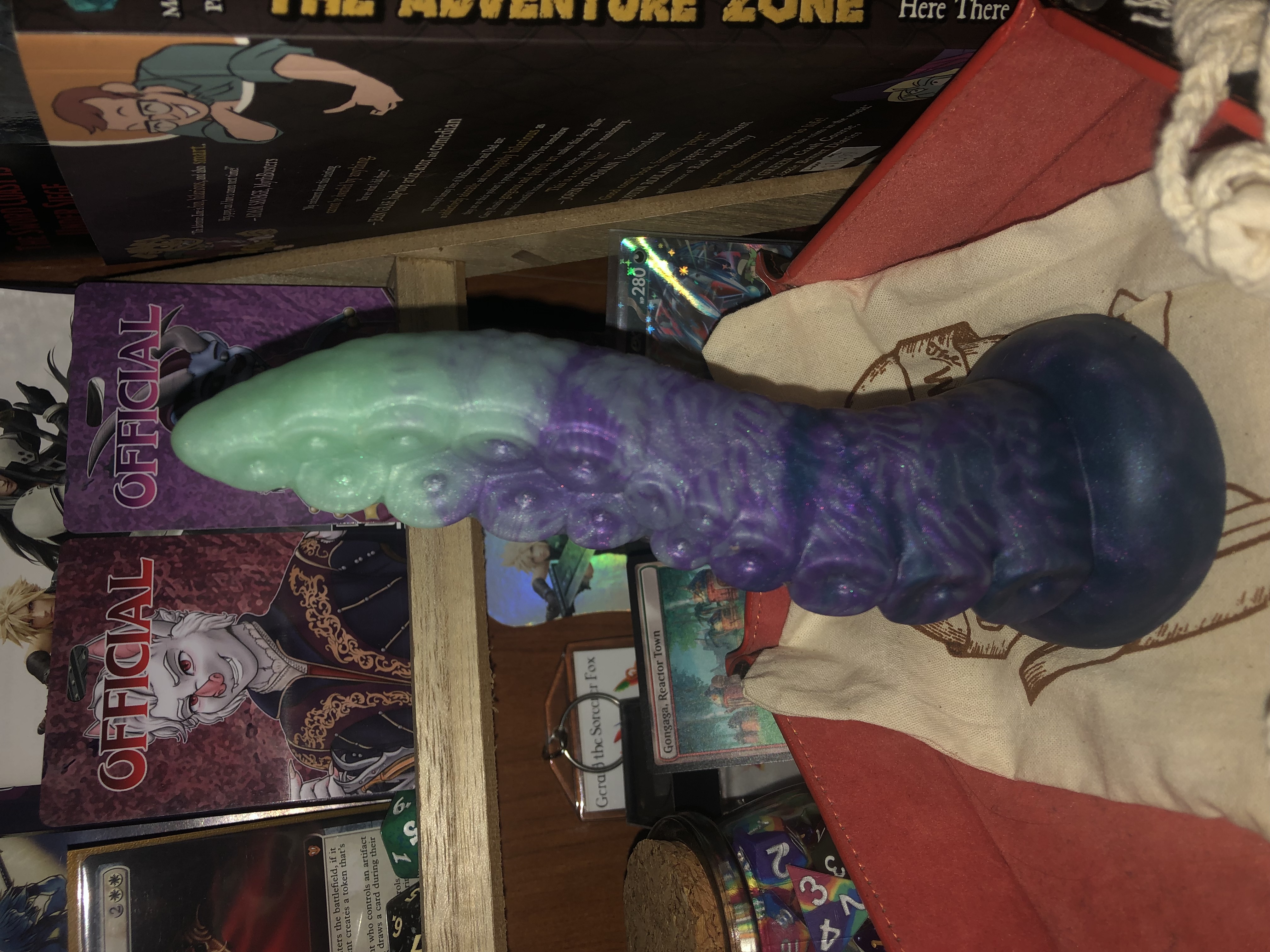 dark mantle tentacle in soft cactus flower, being dark purple at the base and light uv reactive green at the tip