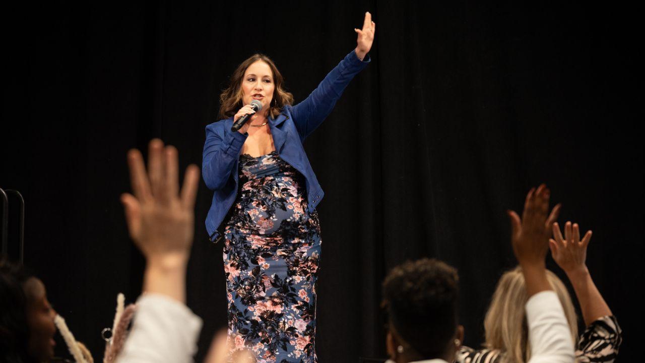 Kimberly Spencer speaking on stage