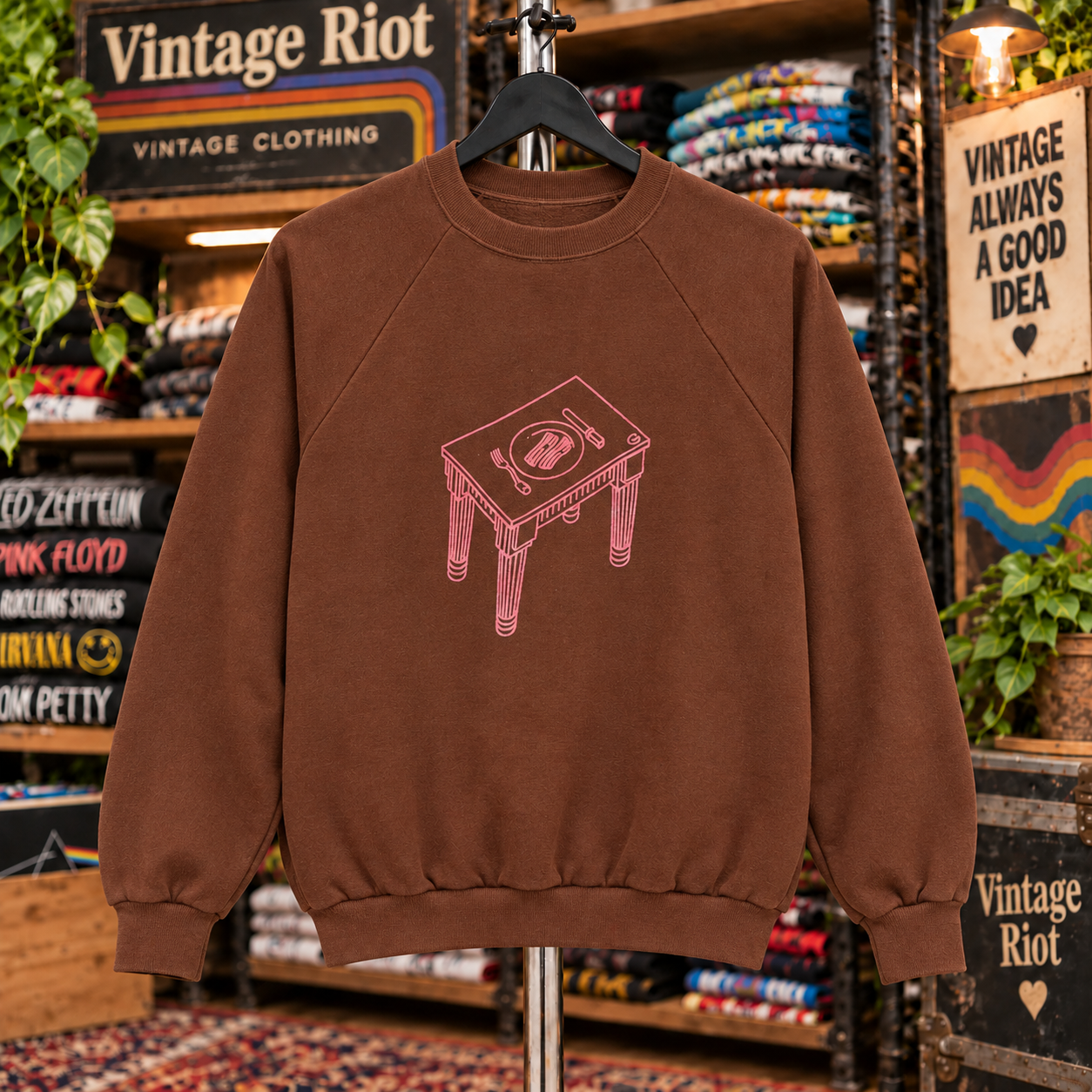 Front view with the pink line-art dining table on the brown Animals retro sweatshirt