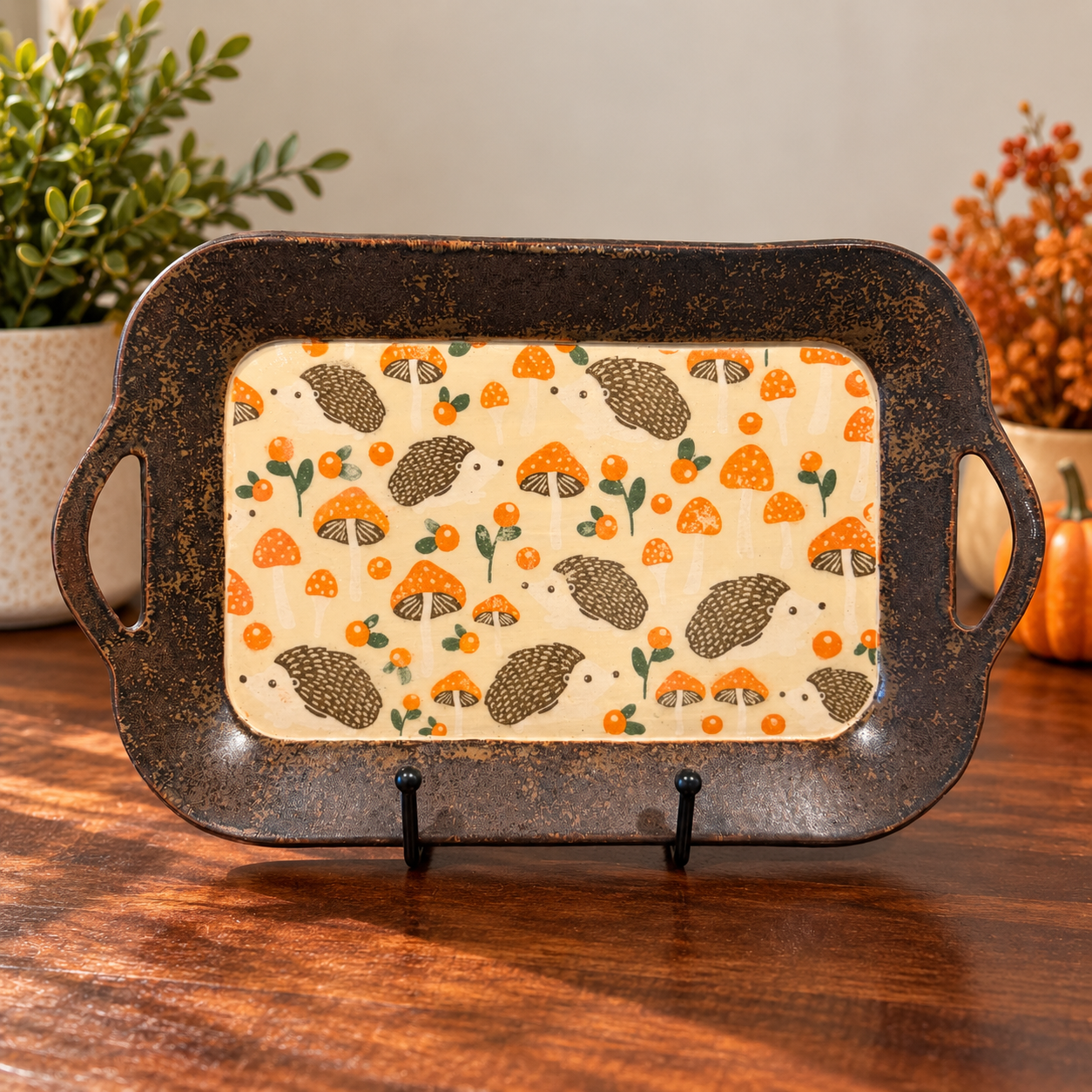 Hand-built tray with a hand-painted hedgehog design.