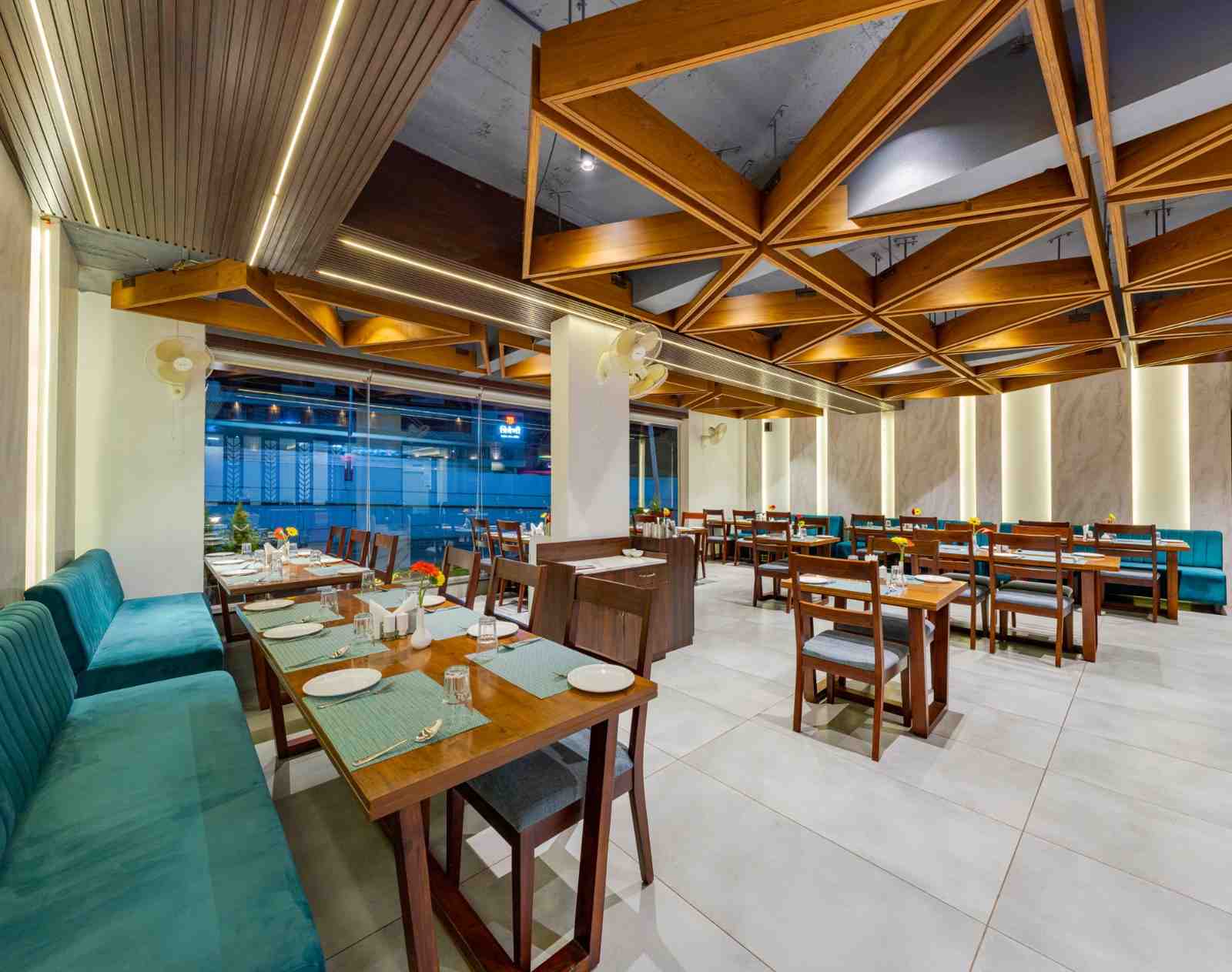 Actual restaurant dining area at Hotel Trisha Executive in Adamapur, Kolhapur