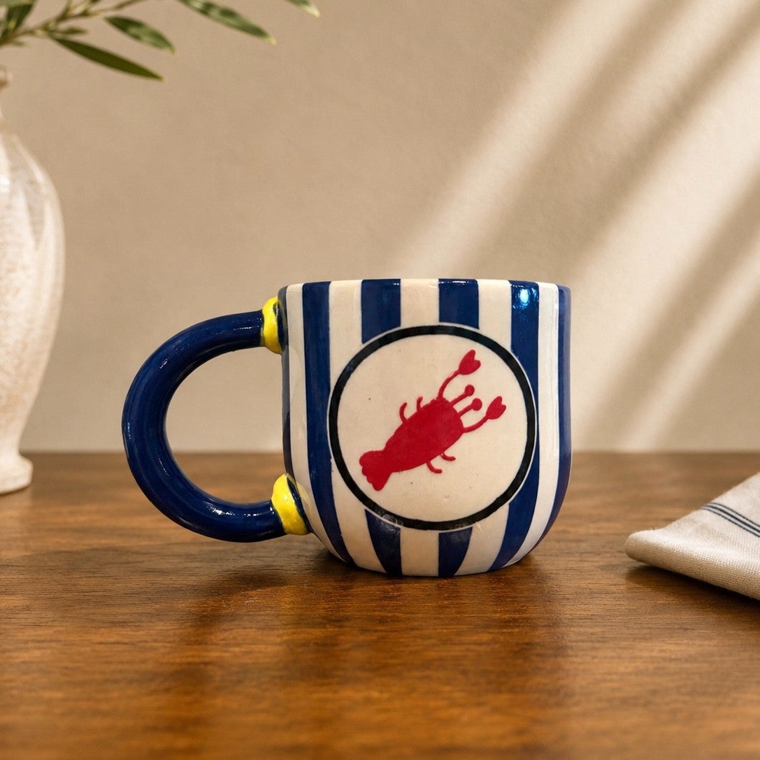 Hand-built mug with hand-painted lobster and lemon details.