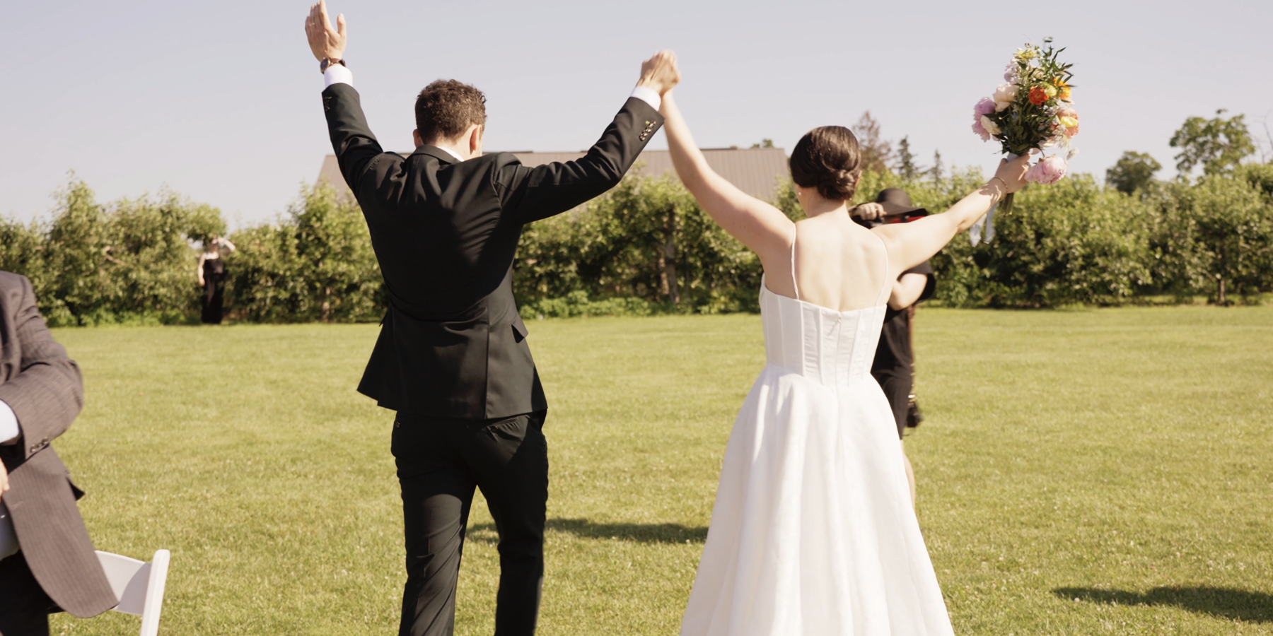 Newly married couple celebrating outdoors