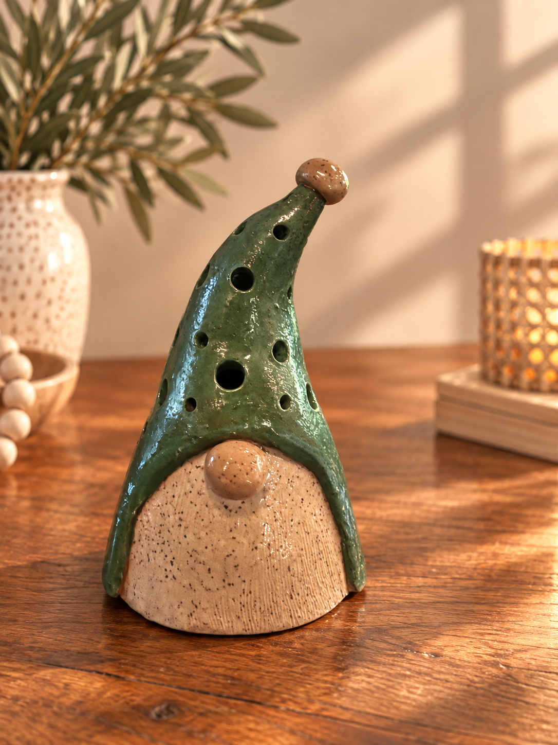 Hand-built gnome luminary in green with hand-painted details.