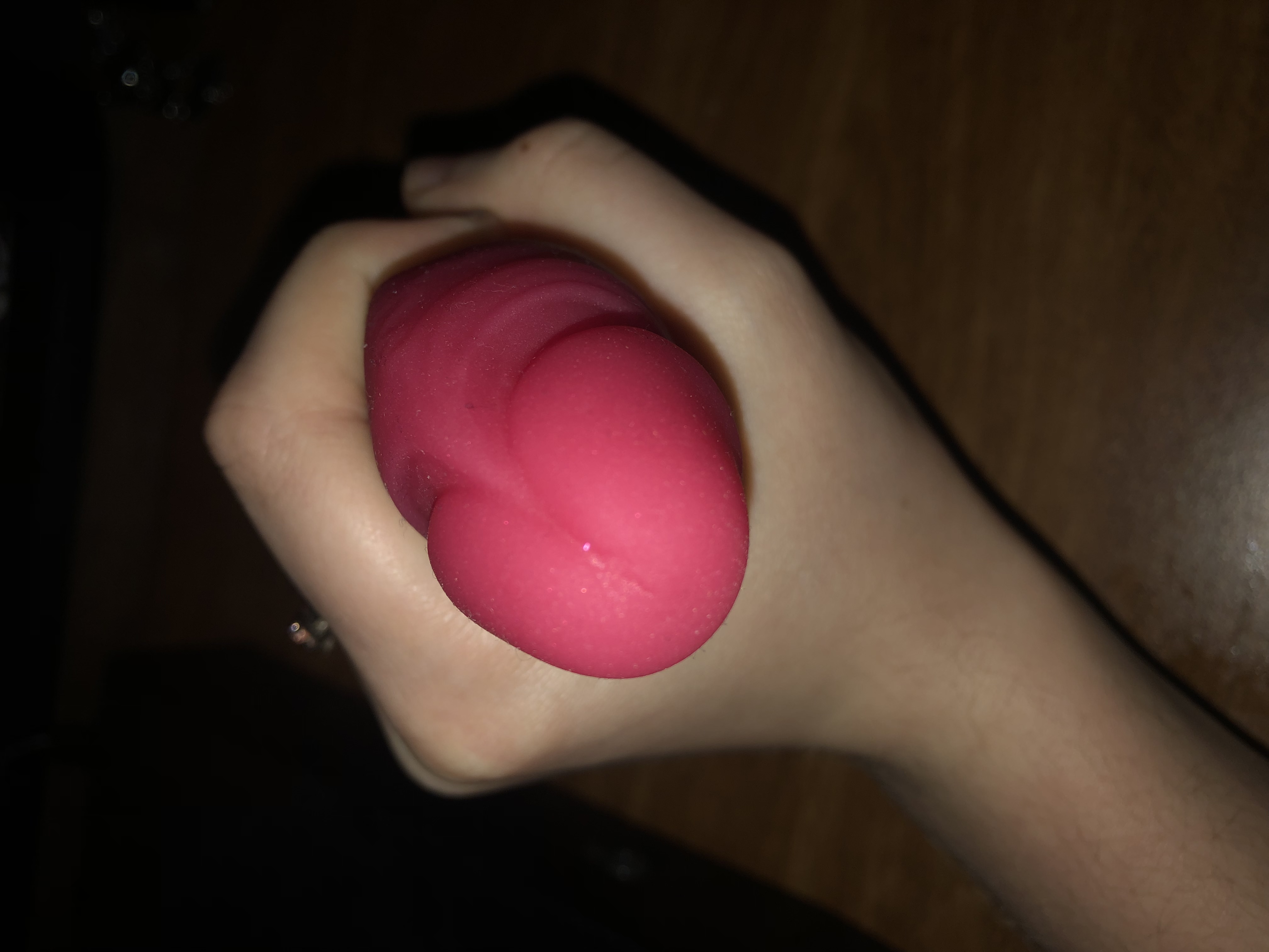 a top-down comparison photo for scale with my hand around it that also shows off the curve