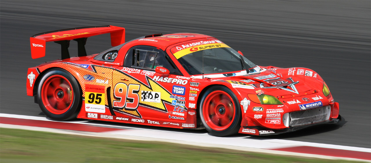 A Toyota MR-S with a livery making it resemble Lightning McQueen from Cars