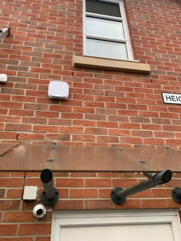 Indoor CCTV dome camera mounted on ceiling monitoring a commercial office space