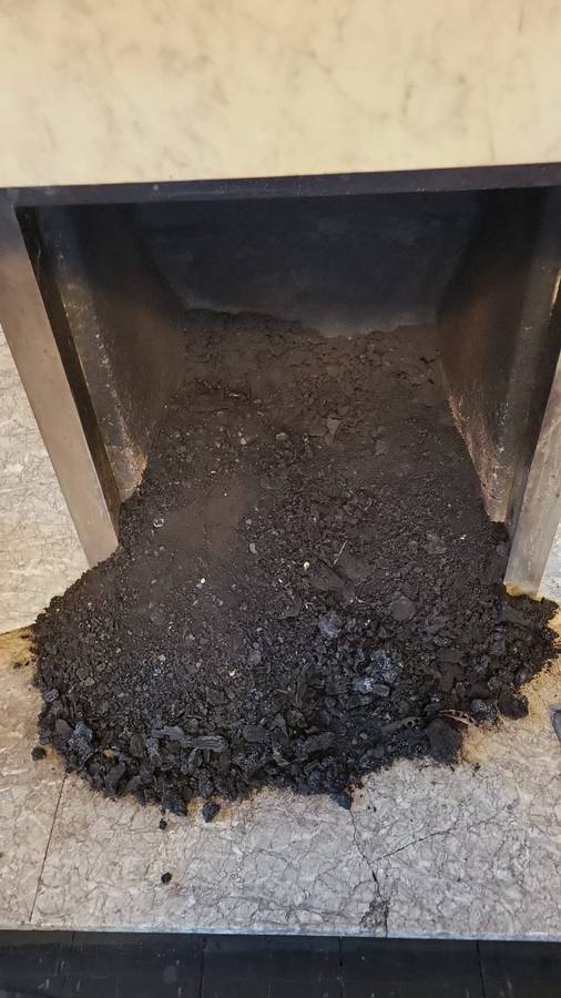 Chimney before sweeping, filled with soot