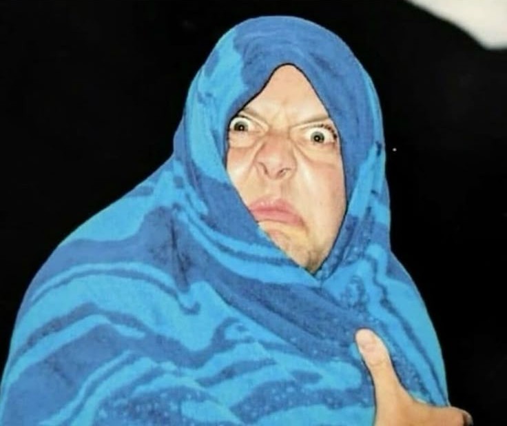 Lars in a blanket, looking at you