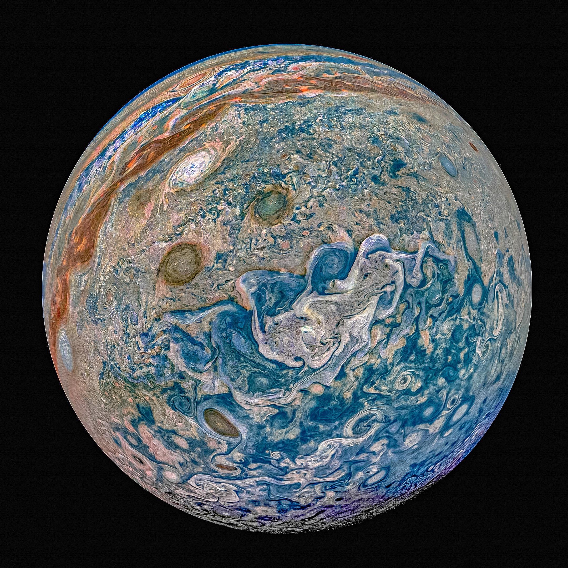 Picture taken from the Juno Spacecraft of NASA of the planet Jupiter. Swirls, which would actually be enormous storms, can be spotted almost everywhere in the surface of the planet. The colors of the planet fade from a strong blue at the bottom right, to a reddish color on the top left. The picture seems like The Starry Night painting made by Van Gogh.