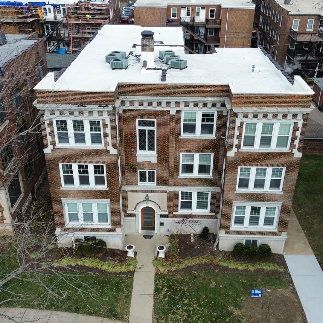 Brick multifamily building after roof work