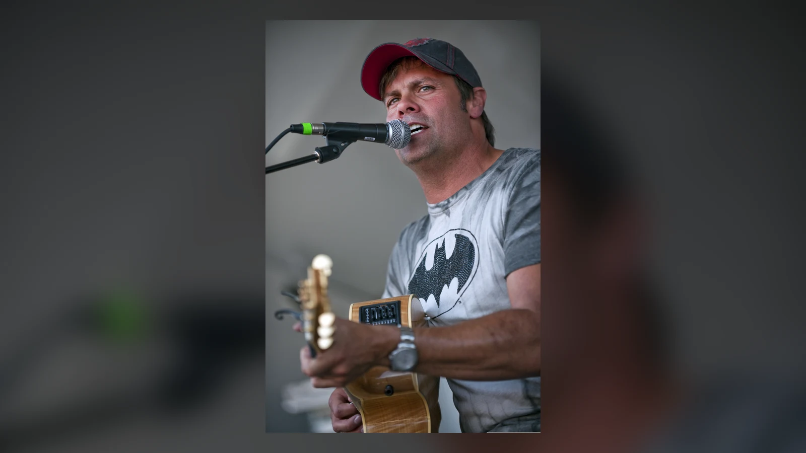 Country singer Troy Gentry performing with a guitar