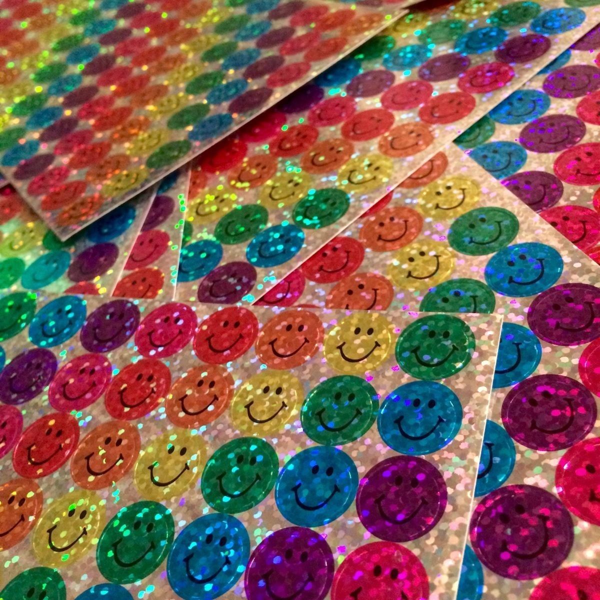 Pages of the glittery smiley face stickers they gave you in elementary school for good behavior