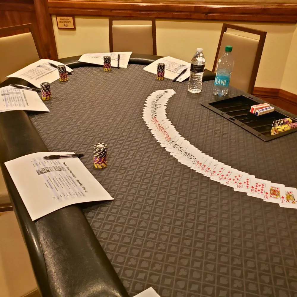 Poker table, cards, and chips set for a corporate event