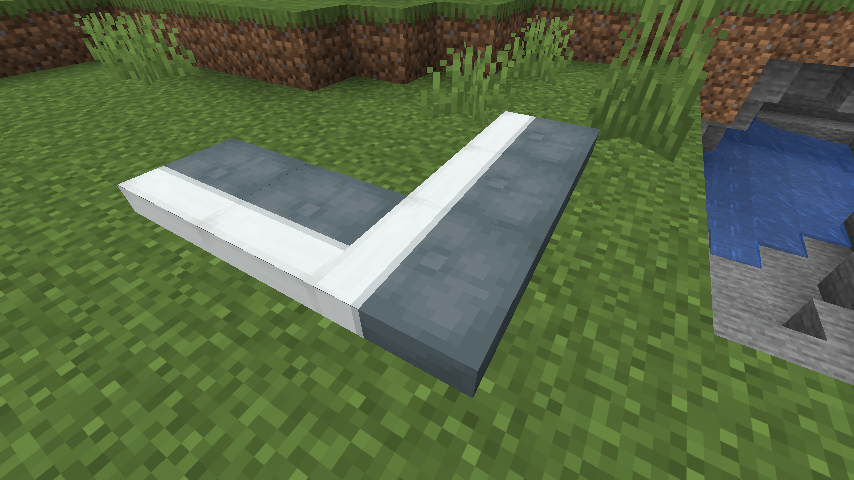 A white band turning neatly across an L-shaped cushion arrangement