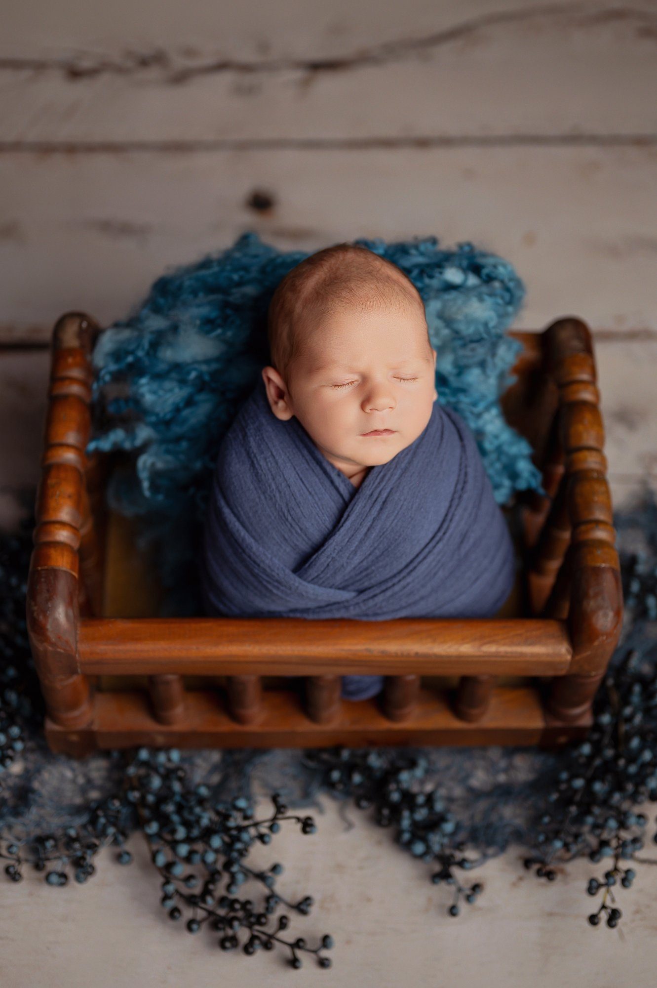 Professional newborn photography setup showing safe posing techniques and studio equipment at Cuckoo Hill Farm