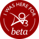 Circular badge with the words 'I was here for beta' with an AO3 logo
