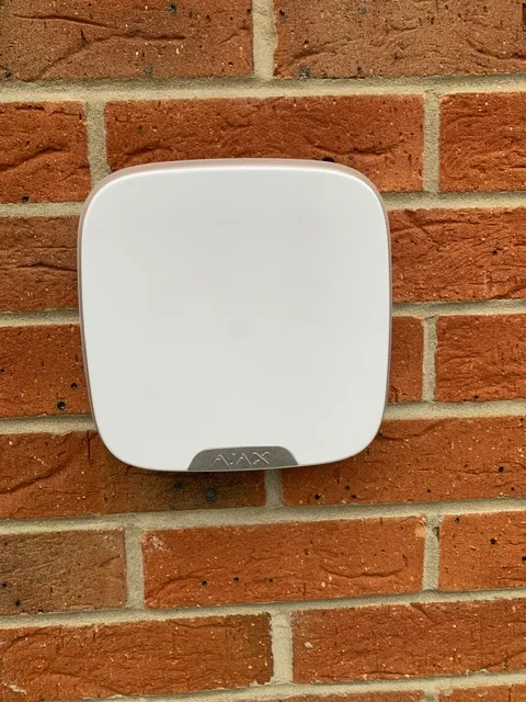 Mobile app interface showing live remote viewing of multiple security camera feeds