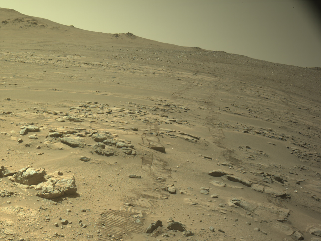 Perseverance wheel tracks cross the rocky Martian landscape