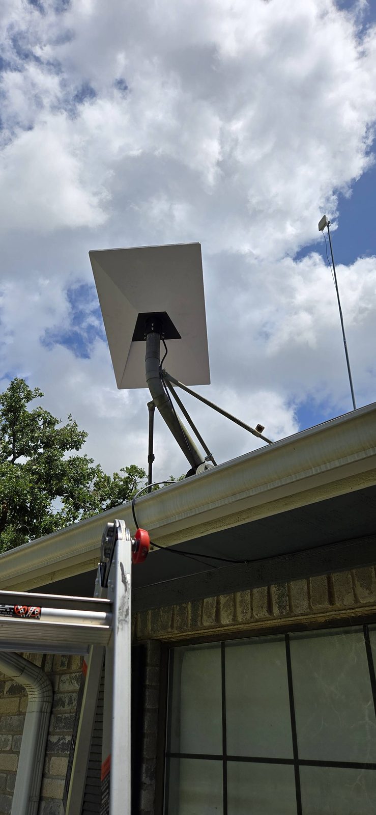 Starlink dish mounted under the eave