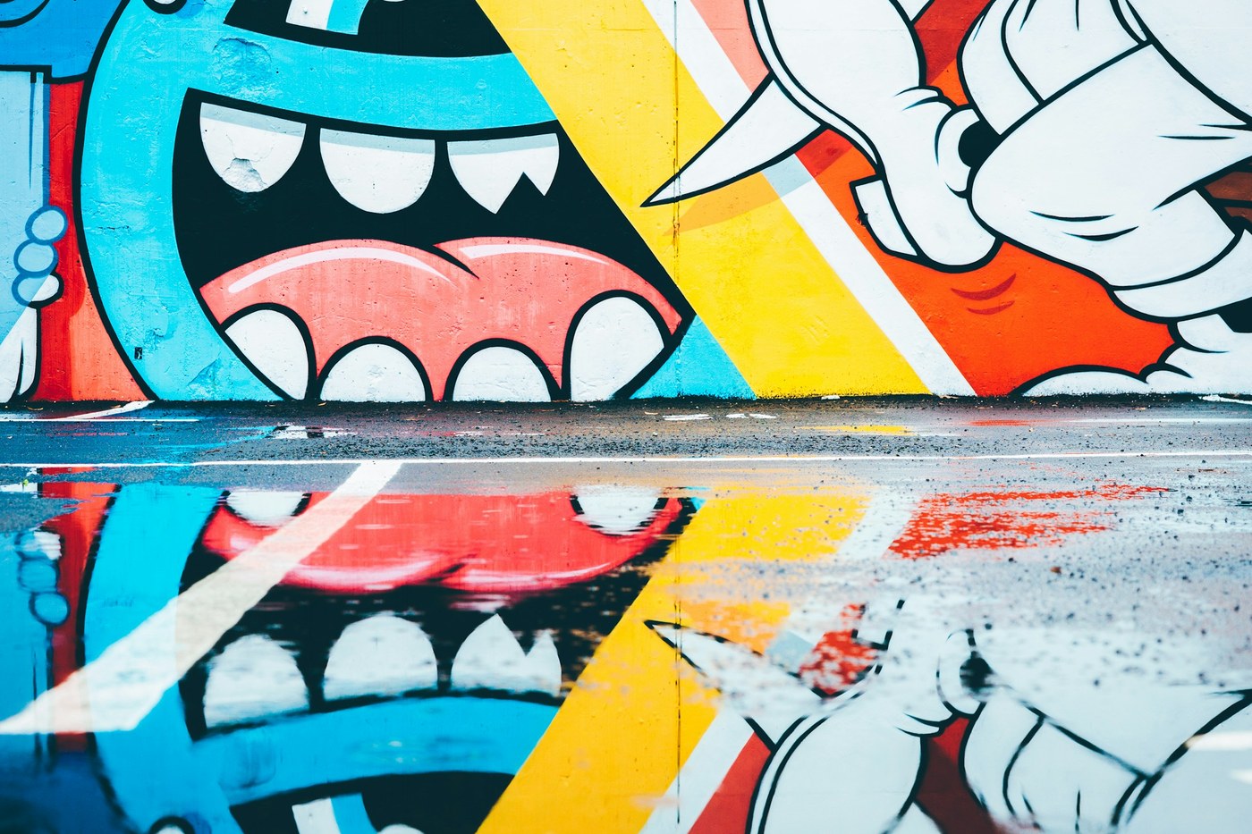 A colorful public mural painted on an exterior wall in Atlanta.