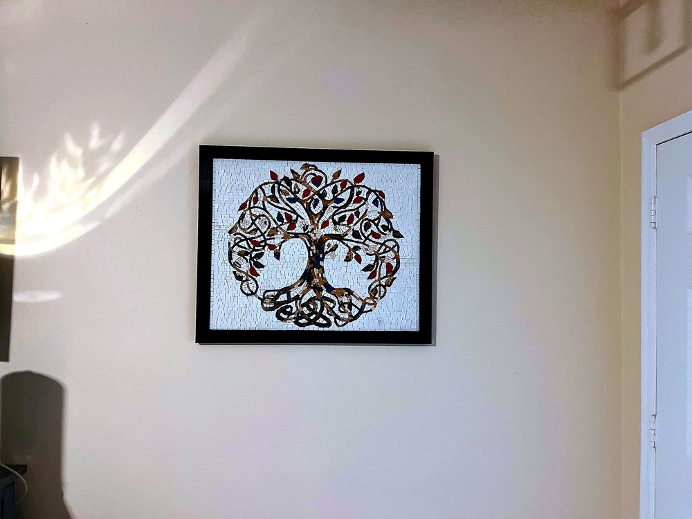 Luxury entryway mosaic art, a handcrafted stone mosaic mural for an indoor wall with abstract patterns and soft textures.