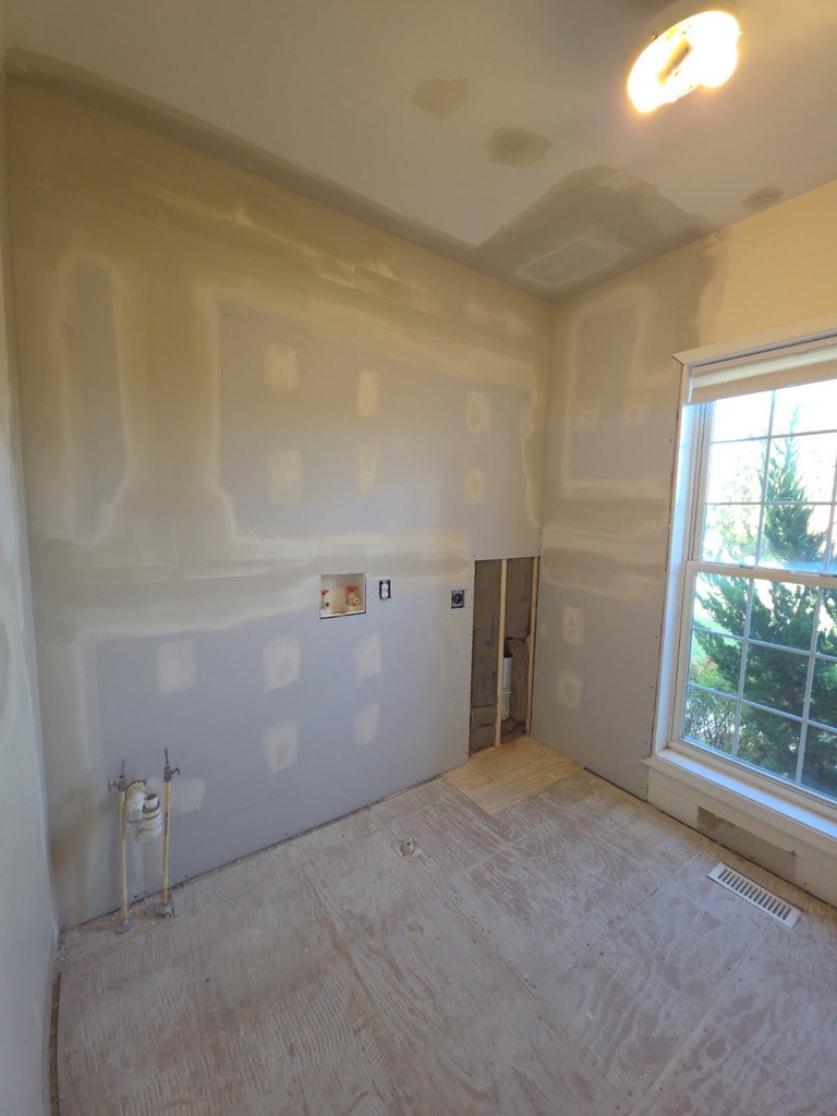 Laundry room after new drywall went up