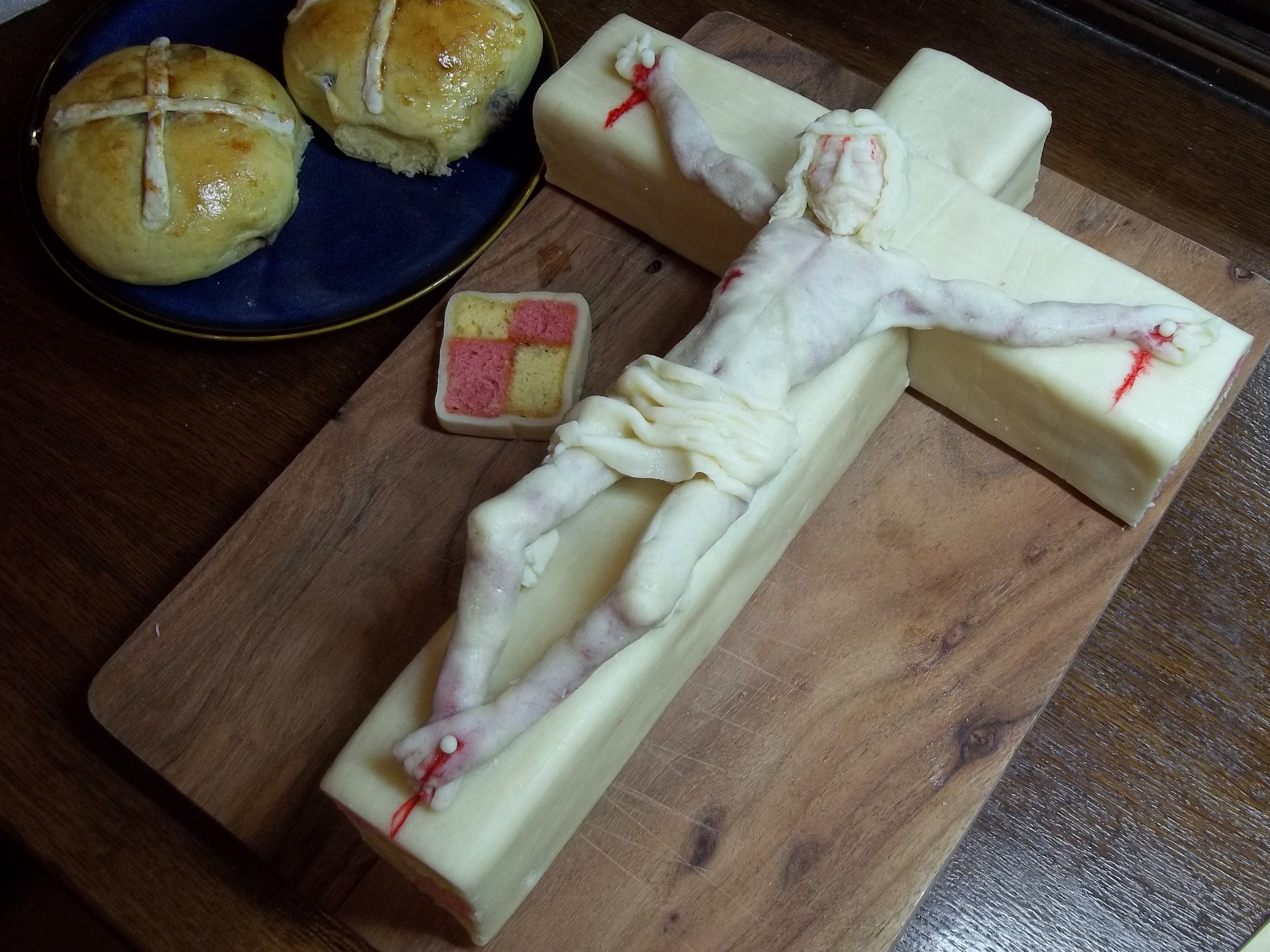 a sculpture of jesus, crucified, made out of marzipan