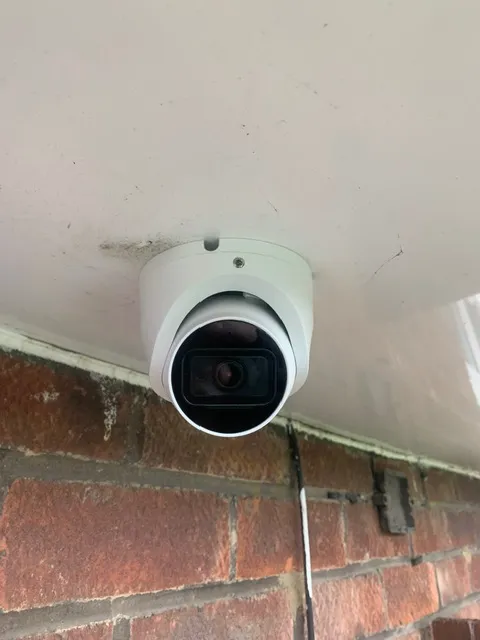 Infographic showing recommended CCTV camera placement positions around a UK property